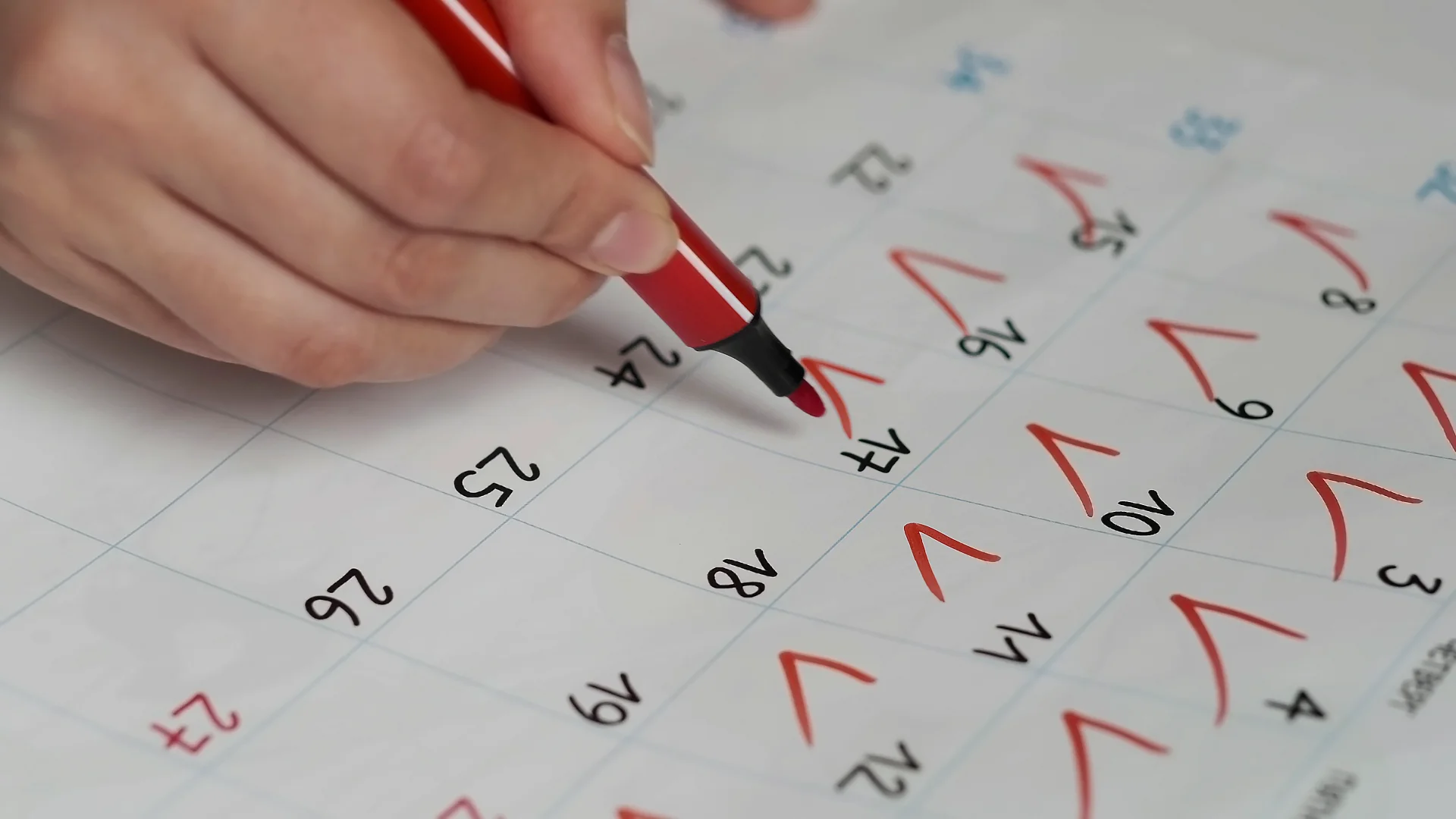 person marking dates of progress in their intervention on the calendar